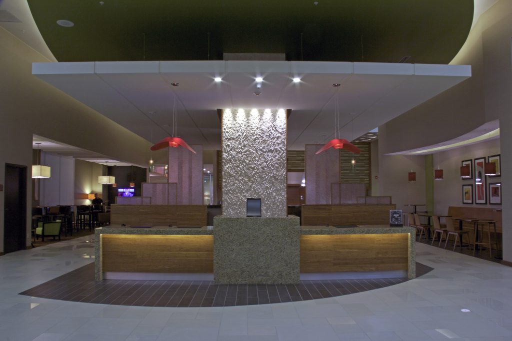 Low angle shot of Hyatt Place lobby in dim light.
