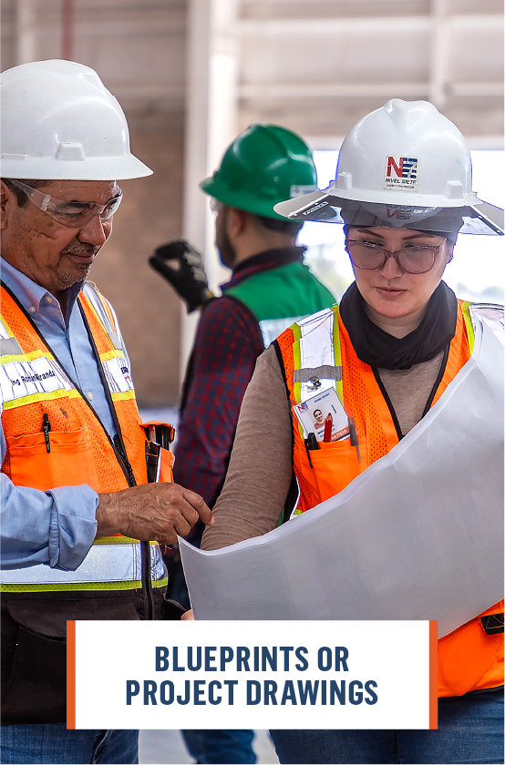 Architect reviewing 3D blueprints of a building design, illustrating the detailed project scope and compliance with industry regulations for comprehensive project understanding